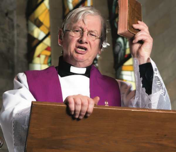 church officiant at a podium holding a bible