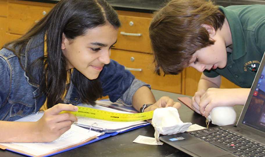 two children in a science class